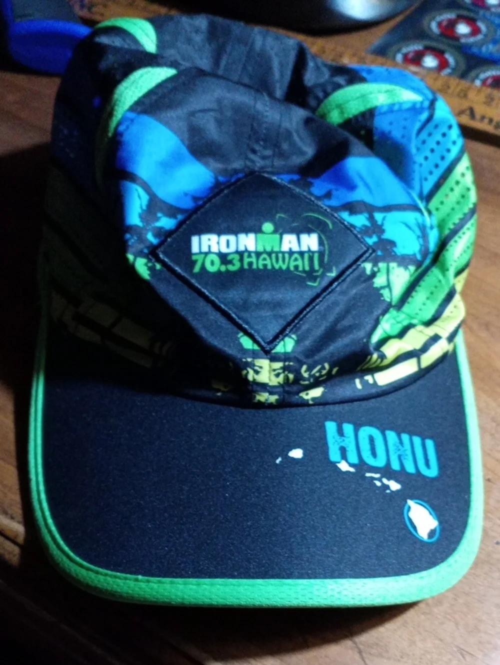 Ironman 70.3 Hawaii Honu Performance Cap - Black/Green/Blue